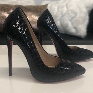 Black pat stilettos w/red sole bottoms
